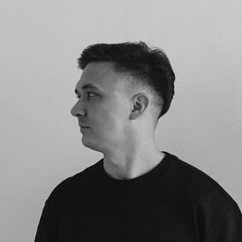 Author of the page looking left, black and white.